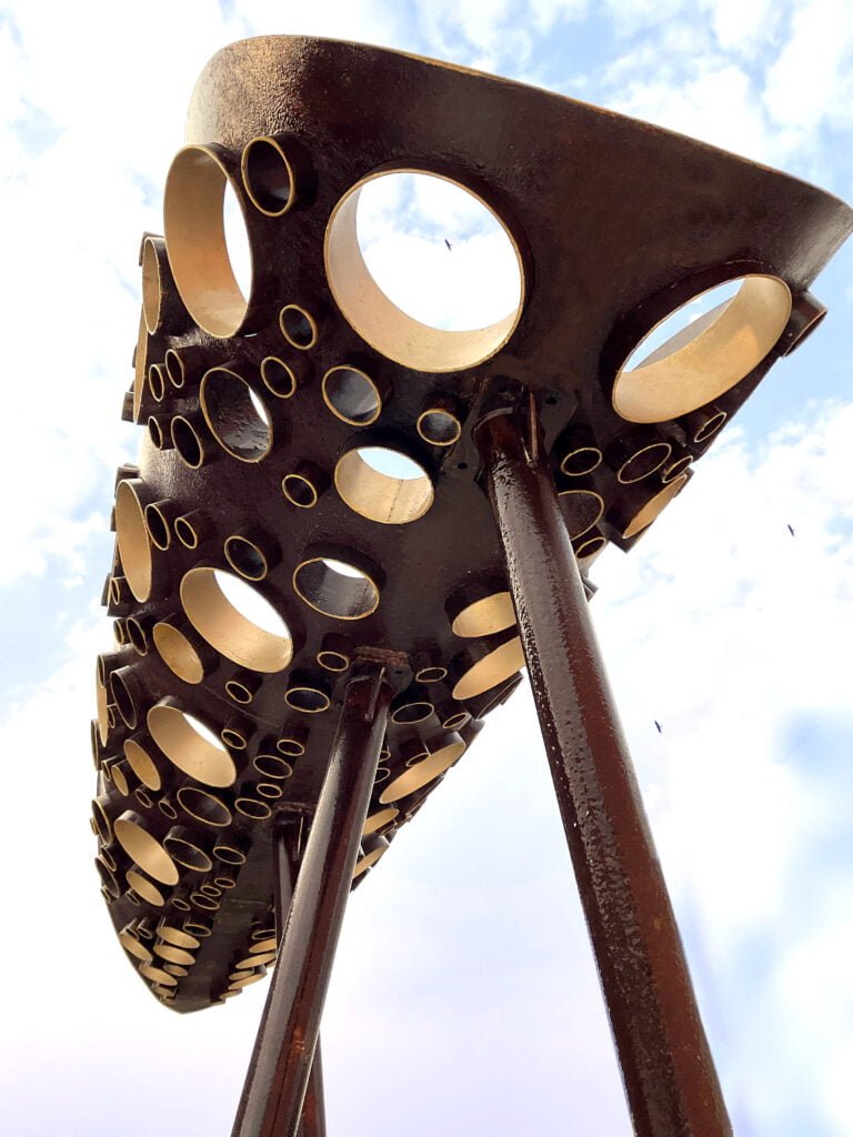 Outdoor garden sculpture in metal, rust and gold finish, leaf shape