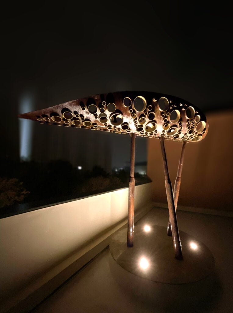 Outdoor garden sculpture in metal, rust and gold finish, leaf shape