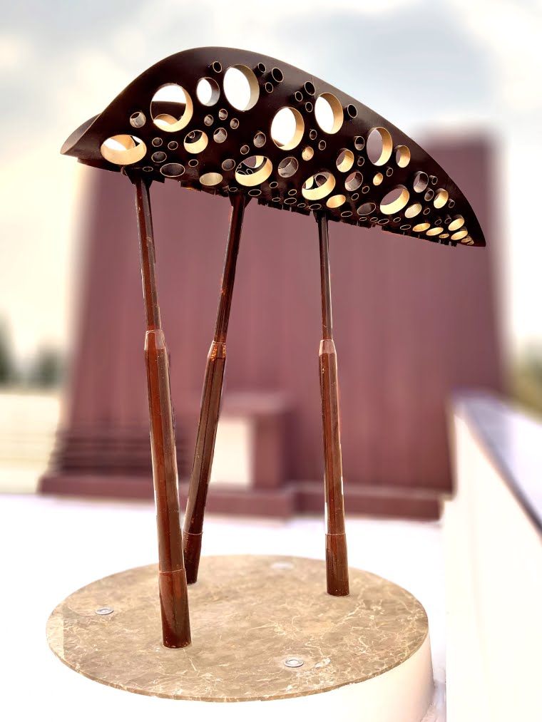 Outdoor garden sculpture in metal, rust and gold finish, leaf shape